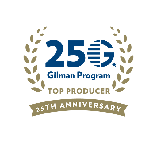 Logo with text: 25 Gilman Program Top Producer 25th Anniversary, framed by gold laurel branches on both sides.
