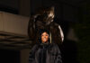 Graduate Spotlight: Deandra Bradley Deandra Bradley, wearing graduation attire, stands in front of a bear statue.