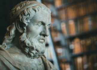 McDonald Center to host 13th A.V. Elliott Conference on Great Books and Ideas Marble bust of a bearded man wearing a headband, with bookshelves blurred in the background.