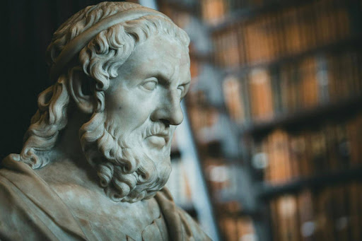 McDonald Center to host 13th A.V. Elliott Conference on Great Books and Ideas Marble bust of a bearded man wearing a headband, with bookshelves blurred in the background.