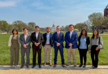 Mercer Model Arab League takes home awards from national conference Eight people stand in a row outside on a path with the U.S. Capitol building visible in the background.