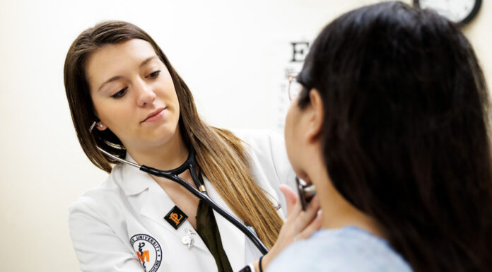 U.S. News ranks Mercer School of Medicine among best graduate medical schools A healthcare professional uses a stethoscope to examine a patient in a medical office.