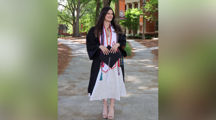 Mercer experiences cultivate senior’s passion for global health work Annie Potts in a graduation gown and cords.