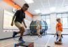 Professor studies impact of physical activity on attention in kids with dyslexia Three boys participate in physical activities in a classroom with exercise equipment and a trampoline in the background.