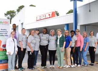 Kids Alliance for Better Care celebrates Washington County Regional Medical Center’s ED as part of Pediatric Emergency Care Project A group of people stands in front of an emergency entrance, posing for a photo next to a kidsABC sign.