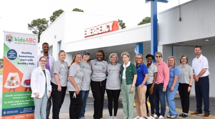 Kids Alliance for Better Care celebrates Washington County Regional Medical Center’s ED as part of Pediatric Emergency Care Project A group of people stands in front of an emergency entrance, posing for a photo next to a kidsABC sign.