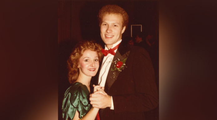 Mercer co-op an integral part of faculty members’ love story A young couple in formal attire pose together while dancing, with the man wearing a tuxedo and the woman in a green dress.