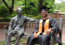Graduate Spotlight: Samuel Pulapakuri Samuel Pulapakuri, in cap and gown, sits smiling on a bench next to the Jesse Mercer statue in Atlanta.