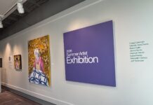 McEachern Art Center opens summer exhibition, relaunches membership program A gallery wall displays art and a large purple sign reading 2026 Summer Artist Exhibition with a list of artists names.
