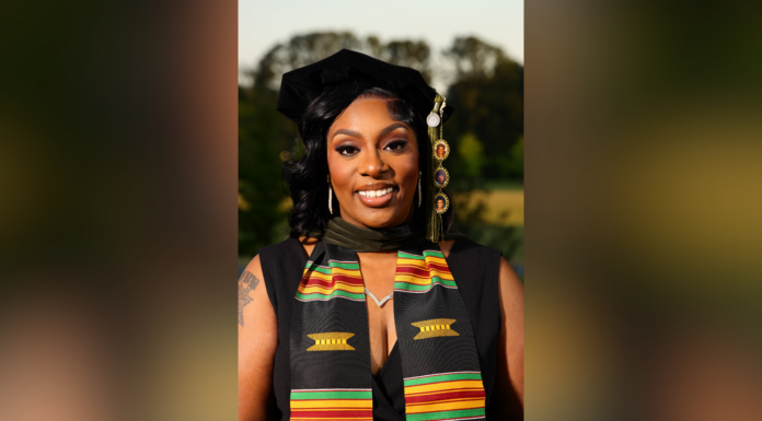 ‘No dream is too big’: Mercer student perseveres to earn Pharm.D. degree A woman in graduation attire with a kente stole smiles outdoors with trees in the background.