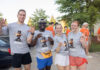 4 things to know about Mercer’s 2026 Opening Days and Bear Beginnings Four students in Mercer University shirts pose and smile outdoors during move-in day, with others in the background.