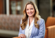 Dr. Stephanie Beavers named senior associate dean of medical school’s Macon campus Dr. Stephanie Beavers in a light blue blazer standing and smiling in the Macon campus lobby.