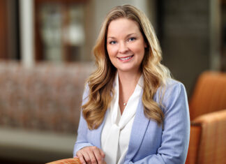 Dr. Stephanie Beavers named senior associate dean of medical school’s Macon campus Dr. Stephanie Beavers in a light blue blazer standing and smiling in the Macon campus lobby.