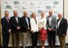 Alumna Chloe Paulk selected as Georgia Student Finance Commission Moment of Impact speaker Seven people standing in a row and posing for a photo in front of a Georgia Match event backdrop.