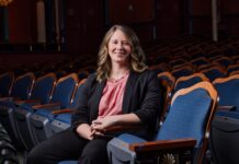 Support for the arts in Macon lands Mercer executive director on 5 Under 40 list Julia Morrison sits in a theater.