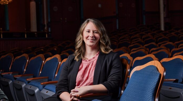 Support for the arts in Macon lands Mercer executive director on 5 Under 40 list Julia Morrison sits in a theater.