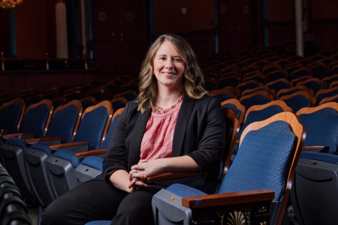 Julia Morrison sits in a theater.