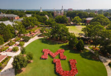 Mercer welcomes over 1,100 new students for Opening Days and Bear Beginnings 2026 Students form a large MU on Cruz Plaza, with historic university buildings and trees in the background on a sunny day.