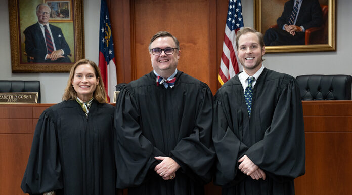 Georgia Court of Appeals holds oral arguments at Mercer School of Law Three judges in black robes stand side by side in a courtroom.