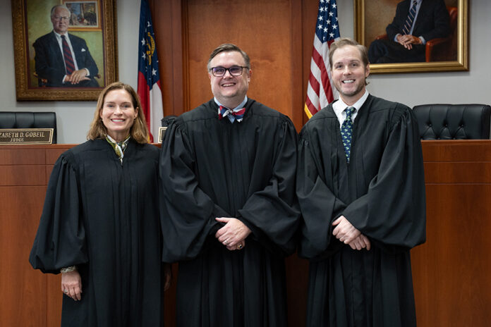 2026CourtofAppealsMercer-MR-22 Three judges in black robes stand side by side in a courtroom.