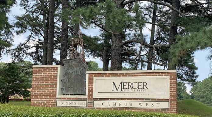 Faculty and Staff Notables | October 2026 Mercer University Campus West entrance sign with brick base, greenery, and trees in the background.