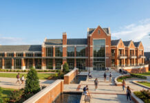 Mercer University reveals first look at new student life center Artist rendering of a large brick academic building with tall windows and landscaped paths on a sunny day.