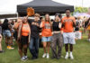 3 things to know about Mercer vs. Western Carolina football game day: Oct. 10, 2026 Five students in Mercer University gear making bear claw hand gestures in front of a tent.