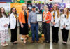 Georgia Agriculture Commissioner declares Mercer School of Medicine the State’s Official Georgia Grown Medical School Group of seven people posing for a photo, with one person holding a framed certificate at an agricultural trade show.