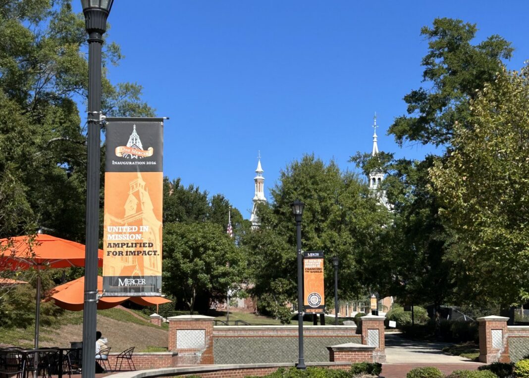 Mercer University campus walkway with banners reading United in Mission. Amplified for Impact.