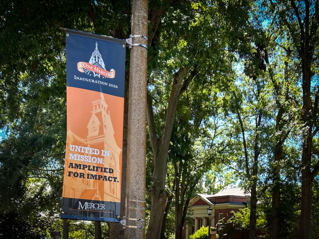 A banner on a pole reading One Mercer Inauguration 2026: United in Mission. Amplified for Impact.