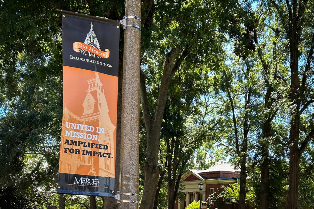 A banner on a pole reading One Mercer Inauguration 2026: United in Mission. Amplified for Impact.