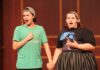 Mercer Opera brings classic novel to life in latest production A young man and woman holding hands while singing on a stage.